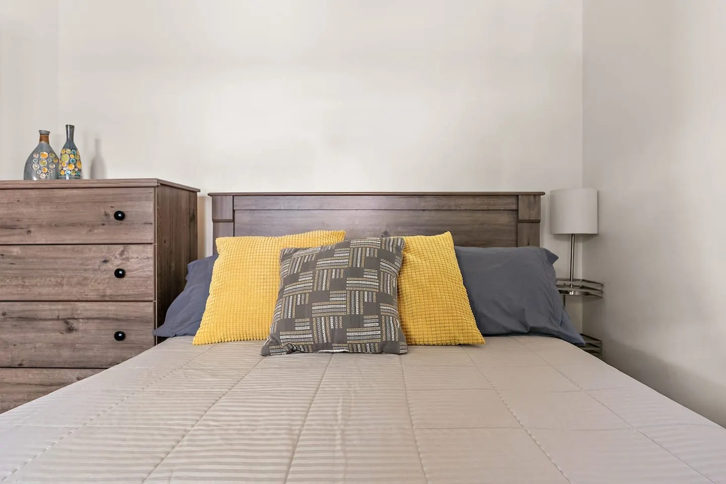 Second bedroom with a double bed and dresser